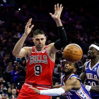 Bulls center Nikola Vucevic loses the basketball against Sixers guard Jared Butler with center Adem Bona in the second quarter.