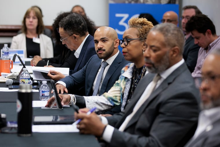 Michael Luke, Fellow in Pediatric Hospital Medicine at Children's Hospital of Philadelphia, listens during a roundtable warning that billions of dollars in Republican-proposed Medicaid cuts will devastate their constituents, especially Black patients, at Enon Tabernacle Baptist Church May 14 in Philadelphia.