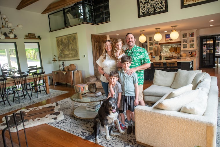 The Corseys (from top left clockwise): Virginia; Griffin, 1; Anthony; Emerson, 9; and Harrison, 5, along with their dog, Clover, in the family room of their historical Dresher home.