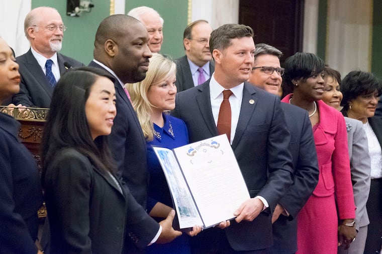 Patrick Murphy (center) is given a citation by Philadelphia City Council in recognition of his being named acting secretary of the Army in 2016. Murphy, a Democrat, represented Pennsylvania's Eighth Congressional District from 2007 to 2011 and was the first Iraq War veteran elected to Congress.