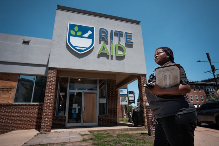 Assistant manager Angela Gardin stands outside the Queen Village Rite Aid. She was moved to tears to see how many customers wrote her and her staff thank-you notes after they found out Rite Aid was going out of business.