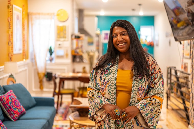 Sharmin Hossain, 32, in her West Philadelphia home. Hossain carefully curated the items and designs in her home, including secondhand finds.