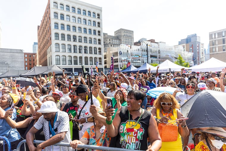 People cheering and singing along with Kid n Play as they perform onstage at the African American Museum's annual Juneteenth Block Party in Philadelphia.
