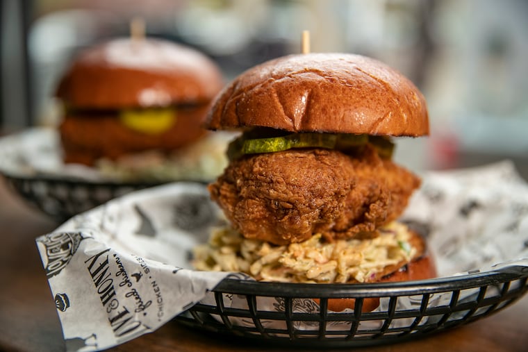 The O.G. chicken sandwich (front) and spicy Nashville hot chicken sandwich are among the offerings at Love & Honey Fried Chicken.