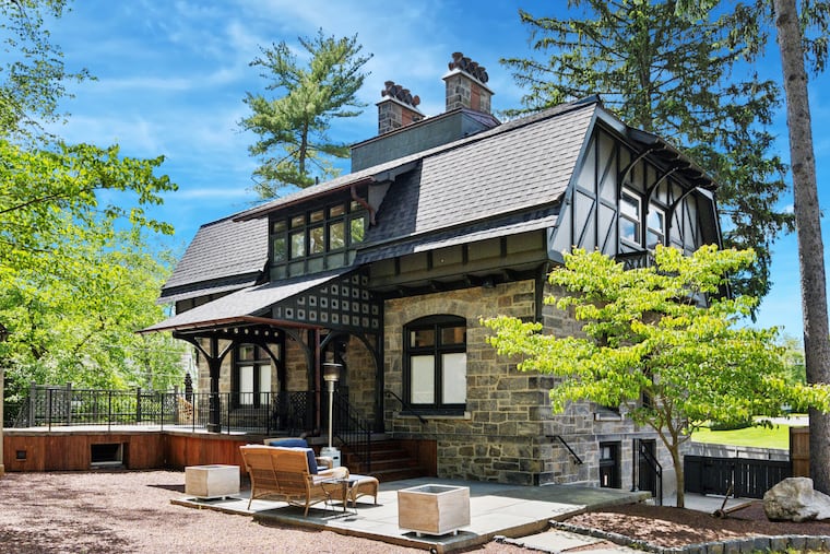 The exterior of the home blends the Arts & Crafts and Tudor styles.