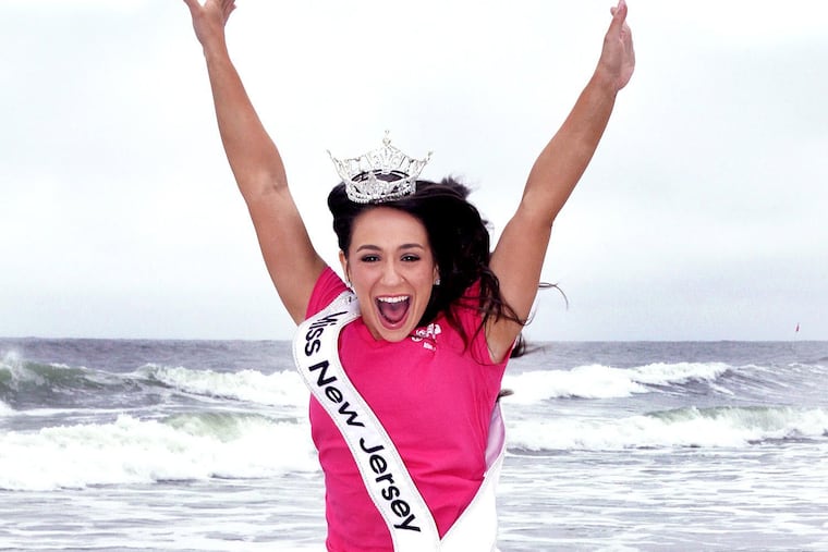 Belle Nicholas, of Wenonah, Gloucester County, taking the traditional toe dip in the Atlantic Ocean on June 15, the morning after winning Miss New Jersey 2025. She will compete for Miss America in September.