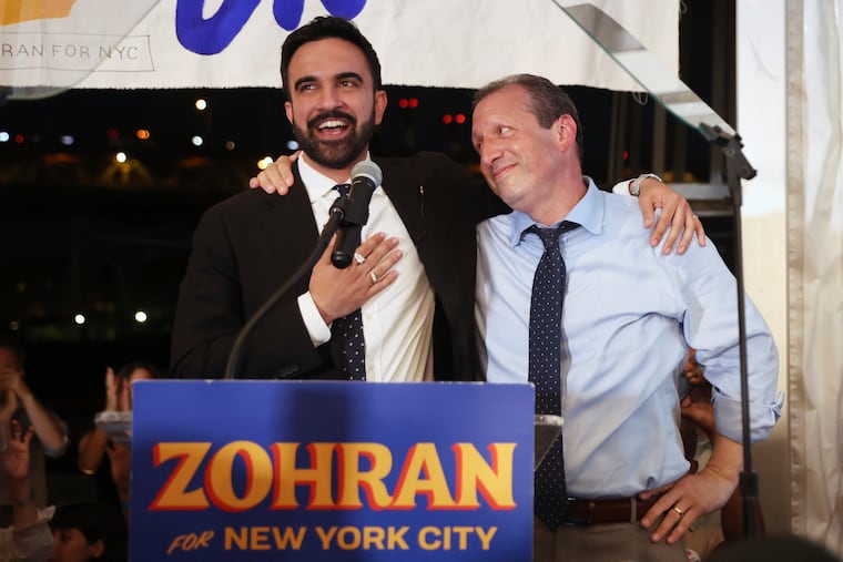 Democratic mayoral candidate Zohran Mamdani, left, speaks on stage with fellow candidate Comptroller Brad Lander at his primary election party on June 25 in New York. 