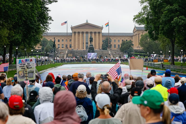 Protesters listen to speakers at the Art Museum steps as part of the “No Kings” protest on Saturday, June 14, 2025, in Philadelphia.