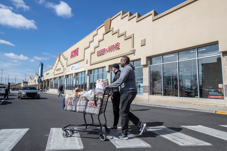 Customers leave the Acme Market in the Bala Cynwyd Shopping Center on City Line Avenue in Montgomery County on Sunday March 15, 2020.