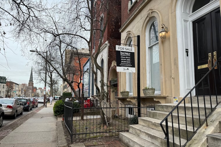 A sign in Philadelphia's Spring Garden neighborhood advertised a home for sale in March 2024.