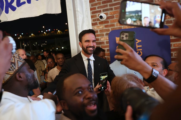 Democratic mayoral candidate Zohran Mamdani takes photos with supporters after speaking at his primary election party on Wednesday, June 25, 2025, in New York.