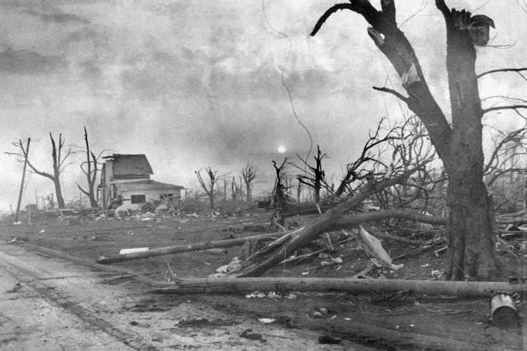 A path of destruction is obvious as the sun slowly sets in Atlantic, Pa., on May 31, 1985, after a twister all but leveled the small town, leaving five dead and dozens injured. About a dozen homes were flattened, and most of those remaining were severely damaged. In all, 64 people were killed in Pennsylvania.