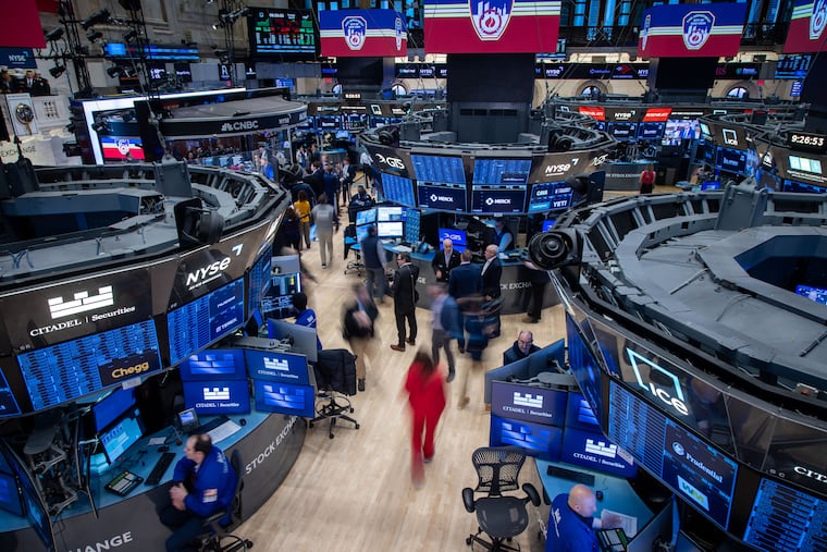 Traders work on the floor of the New York Stock Exchange on Tuesday, April 8, 2025. 
