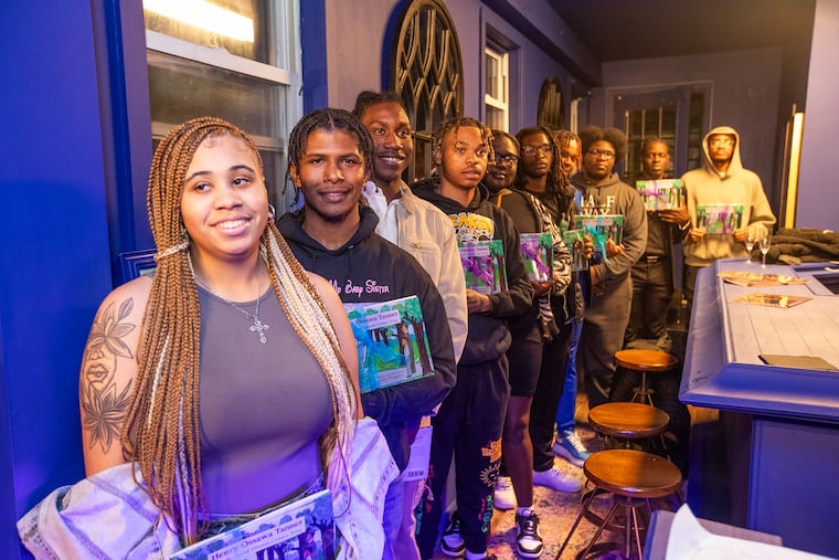 Students headed to Paris during their send-off at Harriett's Bookshop. Harriett's owner, Jeannine A. Cook, raised more than $60,000 to show the kids a world beyond Philadelphia.
