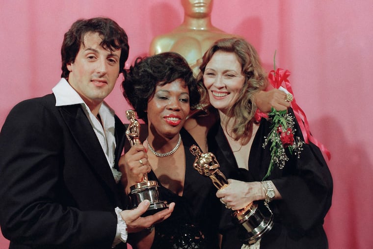 In this March 1977 file photo, Sylvester Stallone holds the Oscar for best picture for "Rocky," Eletha Finch (center) holds the Oscar she accepted for her late husband, Peter Finch, who was named best actor for his performance in "Network," and Faye Dunaway holds the Oscar she won for best actress in "Network."